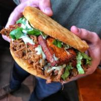 Shredded Beef Fried Arepa · Traditional Cornmeal Cake with shredded beef topped with lettuce, tomato, fried cheese, our ...