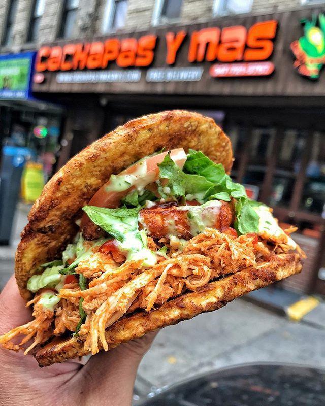 Shredded Chicken Patacon · Twice Fried Green Plantain sandwich with Shredded Chicken topped with lettuce, tomato, fried cheese, our signature house mayo, and ketchup