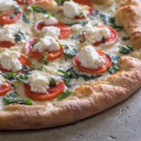 Manresa Pizza · White pizza with fresh basil, garlic, Roma tomatoes and ricotta cheese.