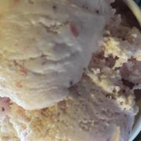 Strawberry Ice Cream · Sweet cream ice cream mixed with pureed strawberries. Gluten free and vegetarian.