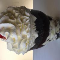 Cookielicious Sundae · Cookies and cream cake batter ice cream with crushed cookies and our homemade hot fudge topp...