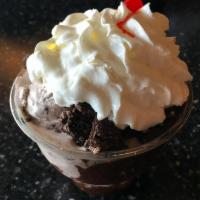 Mint Cookies and Cream Sundae · Mint cookies and cream ice cream with homemade hot fudge, crushed cookies and topped with wh...