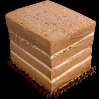 Tiramisu Cake · Incredible tiramisu ice cream stacked between thin layers of moist cake, garnished with fudg...