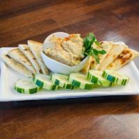 Hummus with Pita · Creamy chickpea hummus blend with lemon and extra virgin olive oil served with warm pita and...