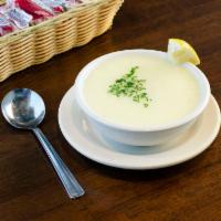 Avgolemono Soup · A delicious traditional Greek soup made from all natural chicken, rice, onions, eggs and lem...