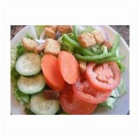Garden Salad · Lettuce, tomatoes, cucumber, bell peppers, carrots, onions and croutons.