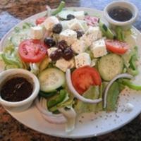 Greek Salad · Lettuce, cucumbers, tomatoes, onions, bell peppers, feta cheese, Kalamata olives, oregano an...