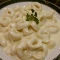 Tortellini · Choice of creamy white sauce, pesto, marinara or homemade meat sauce. Served with bread and ...