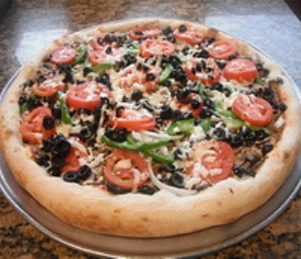 8. Veggie Pizza · Fresh tomatoes, bell peppers, mushrooms, onions, olives, garlic and mozzarella.
