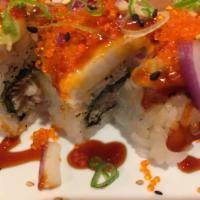 71. Double Hamachi Special Roll · Deep fried hamachi roll topped with seared hamachi, tobiko, onion, and spicy sauce. Spicy.