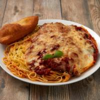 Chicken Parmesan · Lightly breaded buttermilk chicken breasts served over a bed of spaghetti and smothered in o...