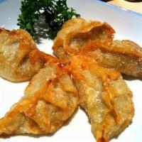 A6. Age Gyoza · 7 pieces of deep-fried dumplings with dipping sauce.