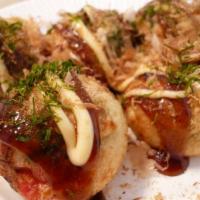 A10. Takoyaki · 7 piece of deep-fried octopus balls with takoyaki sauce.