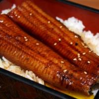D5. Una-ju · Unagi kabayaki (grilled eel) on rice. Served with miso soup and house salad.