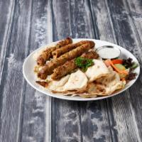 Shish Kabab Wrap · With salad, rice and naan bread.