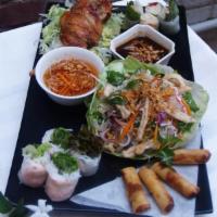 11. BMQ Taste · Mini summer rolls, spring rolls, jicama rolls, stuffed chicken wings and tofu sala d. Served...