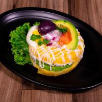 Causa · Mashed potato seasoned with Peruvian spices. Filled with chicken, vegetables, and creamy may...