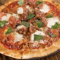 Margherita Pizza · Fresh mozzarella, roasted tomato, garlic, and basil.