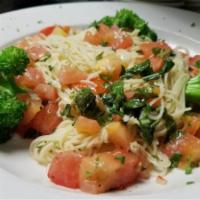 Capellini Primavera Pasta · Capellini with broccoli and tomatoes lightly sauteed with basil, garlic and white wine sauce.