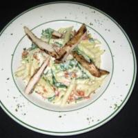 Pasta Poretti · Penne with grilled chicken, sun dried tomatoes and spinach in a goat cheese sauce.