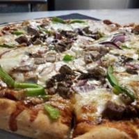 Philly Cheesesteak Pizza · Bianco pizza with mozzarella and provolone cheese, virgin olive oil, hand carved rib eye and...
