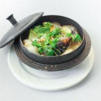 56. Clay Pot Seafood Combination · Shrimp, scallops, squids, mussels with cabbage, celery, green onion and clear noodles in cre...