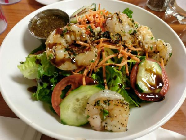 Shrimp Salad · Served with romaine lettuce, tomatoes, cucumbers and carrots, topped with grilled shrimp skewers. Includes homemade bread and your choice of dressing. 