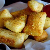 Passion Bread · Tasty bread tossed with garlic butter, parmesan cheese and Italian spices. Served with a sid...