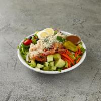 Cobb Salad · Romaine lettuce, turkey bacon, blue cheese, egg, cucumber, onions, olives, pepperoncini, che...