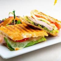 Turkey Panini · Lettuce, tomato, sprouts and olives. Includes our house made pesto (nut free), sun-dried tom...