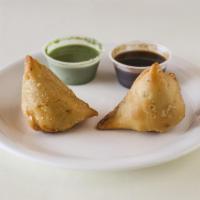 B1. Samosa Plate (2) · Vegetable samosas served with mint chutney and tamarind chutney. Vegetarian.