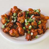 C1. Gobi Manchurian Dry · Batter-fried cauliflower sauteed with onion, ginger, garlic and mild spices and cooked in Ma...