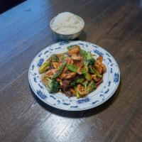 H10. Triple Delight · Jumbo shrimp, sliced tender beef, and breast of chicken sauteed with broccoli, snow peas, mu...