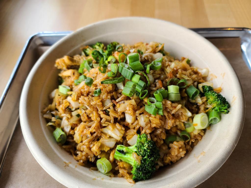 Basil Fried Rice · Basil sauce, Thai peppers, scallions, bell peppers, carrots, cabbage, fish sauce, and fresh basil.