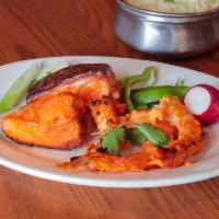 Ginger Garlic Jhinga · Jumbo fresh shrimp gently seasoned and slowly broiled in tandoor with chef's special fresh s...