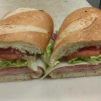 Italian Sub · Made with ham, Genoa salami, pepperoni, provolone, Italian dressing, lettuce, tomato and oni...