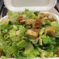Caesar Salad · Made with romaine lettuce, Parmesan cheese, croutons, black pepper and Caesar dressing. 