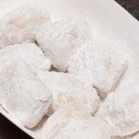 Zeppoli · Fried dough with powdered sugar.