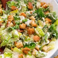Caesar Salad · Crispy homemade croutons and a light caesar dressing. Add chicken for a full pack of protein