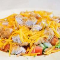 Chopped Salad · Romaine lettuce, breaded chicken breast, bacon, cheddar cheese, tomatoes and cucumbers with ...