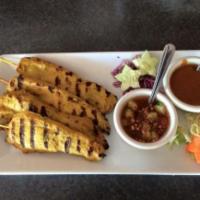 5. Chicken Satay · 4 Pieces. Skewers of chicken breast marinated in Thai herbs, grilled and served with peanut ...