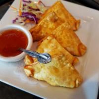6. Crab Rangoon · Golden fried wonton skin stuffed with imitation crab and cream cheese. Served with sweet chi...