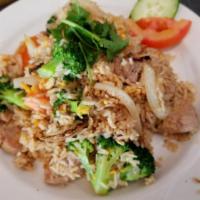 51. House Fried Rice · Traditional Thai fried rice with egg. Broccoli, tomatoes, onions.