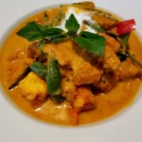 SP5. Salmon Pumpkin Curry · Sweet pumpkin cooked m red curry sauce topped on golden salmon. Spicy.