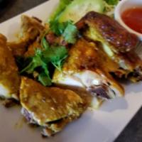 SP18. Thai BBQ Chicken · Marinated chicken prepared with Thai herbs, coconut milk and curry powder. Served with sweet...