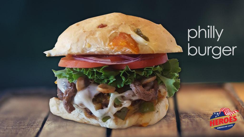 Philly Burger · 100% beef patty piled high with sauteed steak, mushrooms, bell peppers, and onions. Then topped with melted Provolone cheese, tomato, lettuce, mayonnaise, mustard, and pepperoncini. 