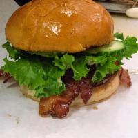 California Burger · 100% beef patty on a toasted Brioche bun topped with bacon, guacamole, lettuce, tomato, Swis...