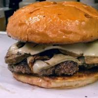 Swiss Mushroom Burger · 100% beef patty on toasted Brioche bun topped with grilled onions and mushrooms, melted Swis...