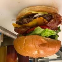 Classic Bacon Cheeseburger · 100% beef patty topped with Applewood smoked bacon, real Cheddar cheese, lettuce, tomato, on...