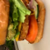 Veggie Burger · Garden Burger patty on toasted Brioche bun topped with  lettuce, tomato, onion, pickle, mayo...